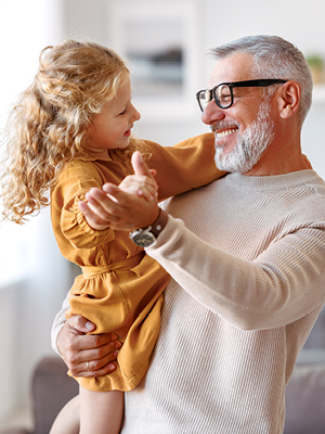 man holding his grand daughter