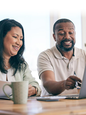 two people looking at a computer