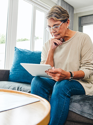 woman looking at her tablet
