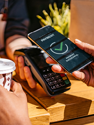 someone paying with their phone