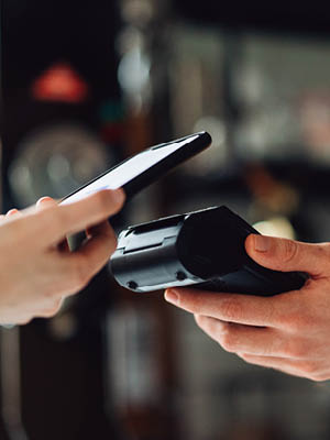 someone paying with their phone