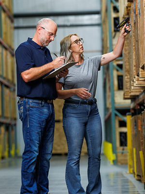 Two people inspecting a warehouse