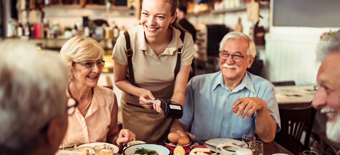 family paying at a restaurant