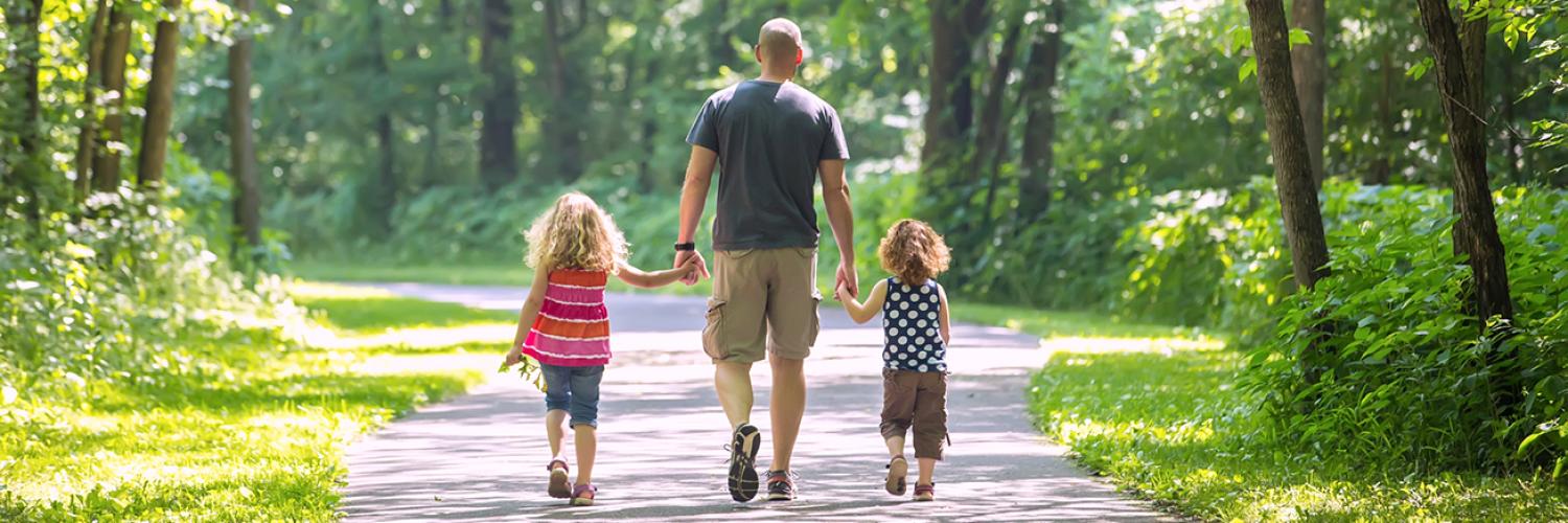 father walking with kids