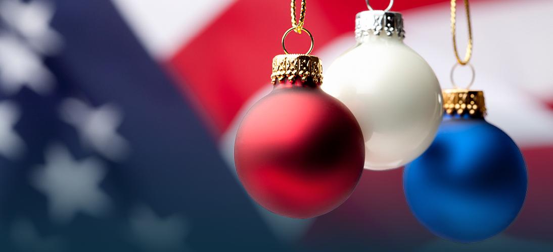 Christmas ornaments by an American flag