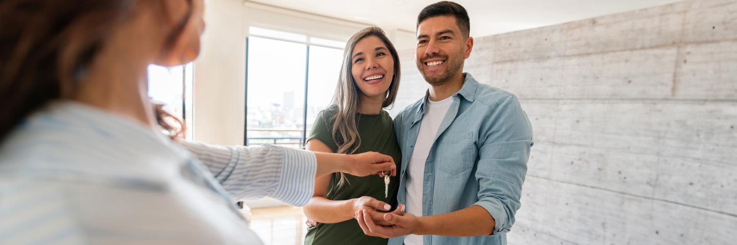 couple talking to a realtor buying a new home