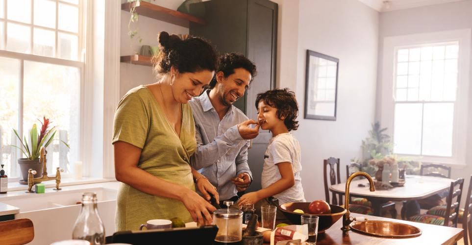 family laughing in the kitchen