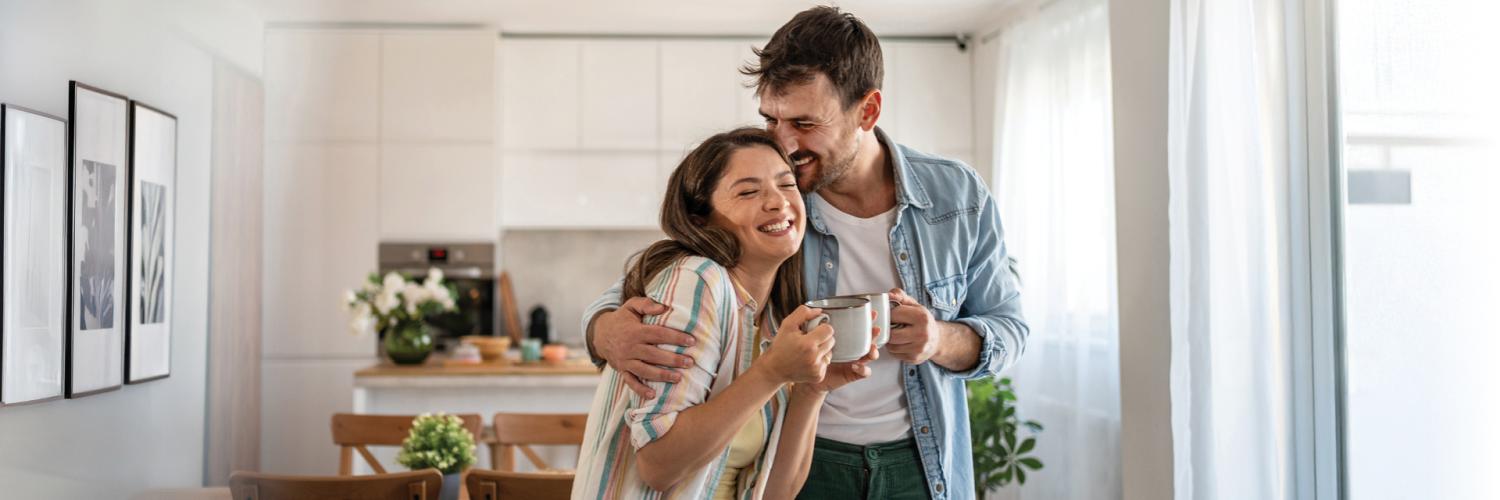Couple drinking coffee and laughing