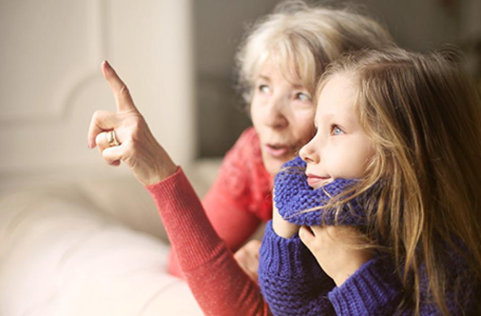 woman and child pointing out window