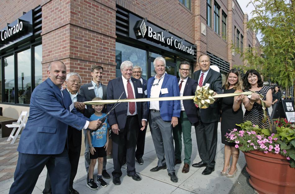 ribbon cutting in front of new bank