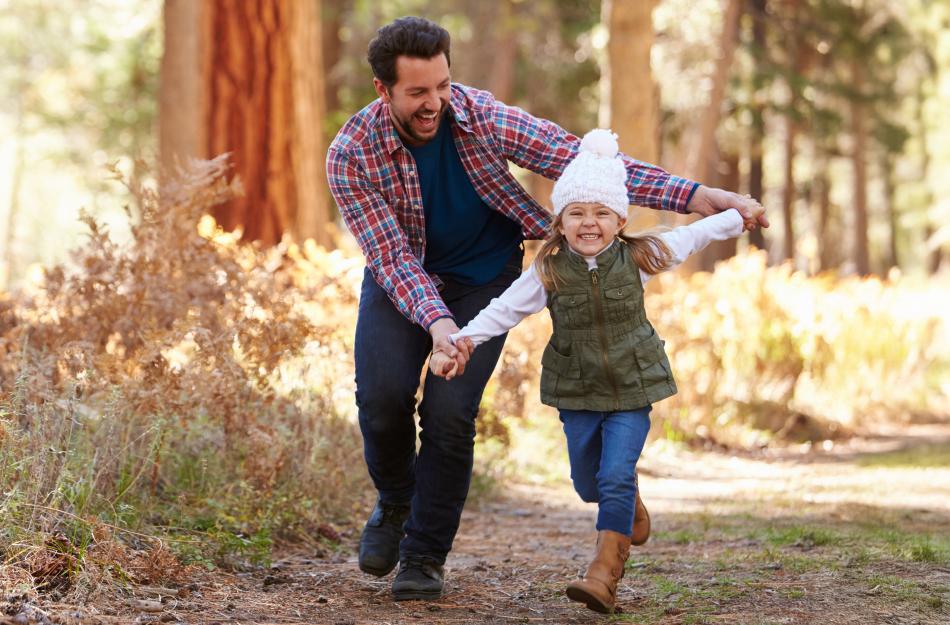 a father running with his child