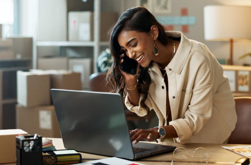 happy woman working on her laptop