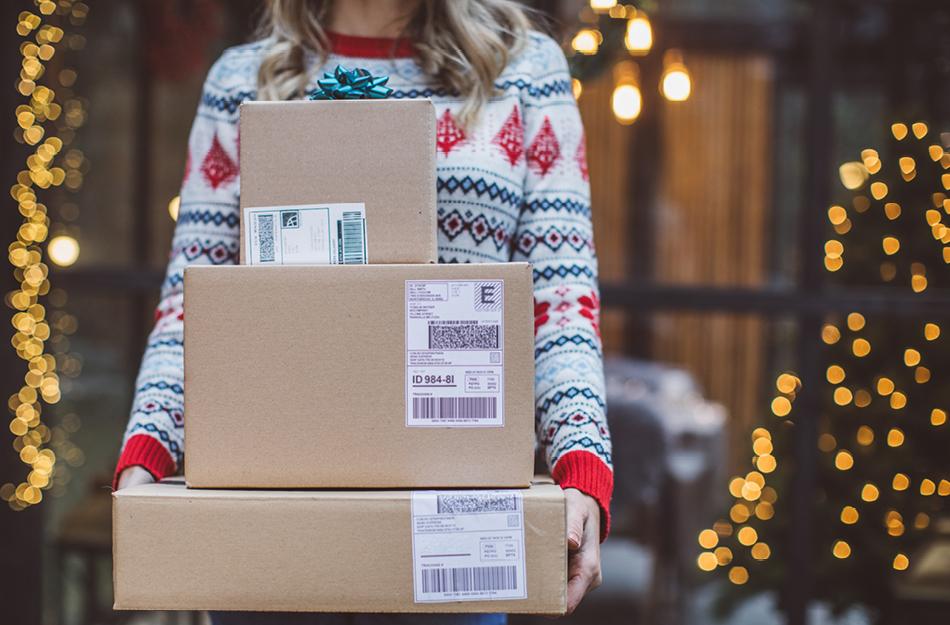 someone holding 3 boxes