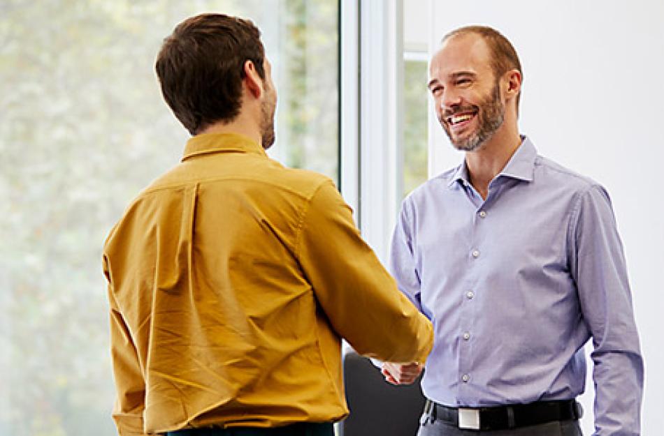 two businessmen conversing