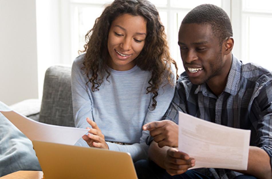 picture of a man and woman looking at papers