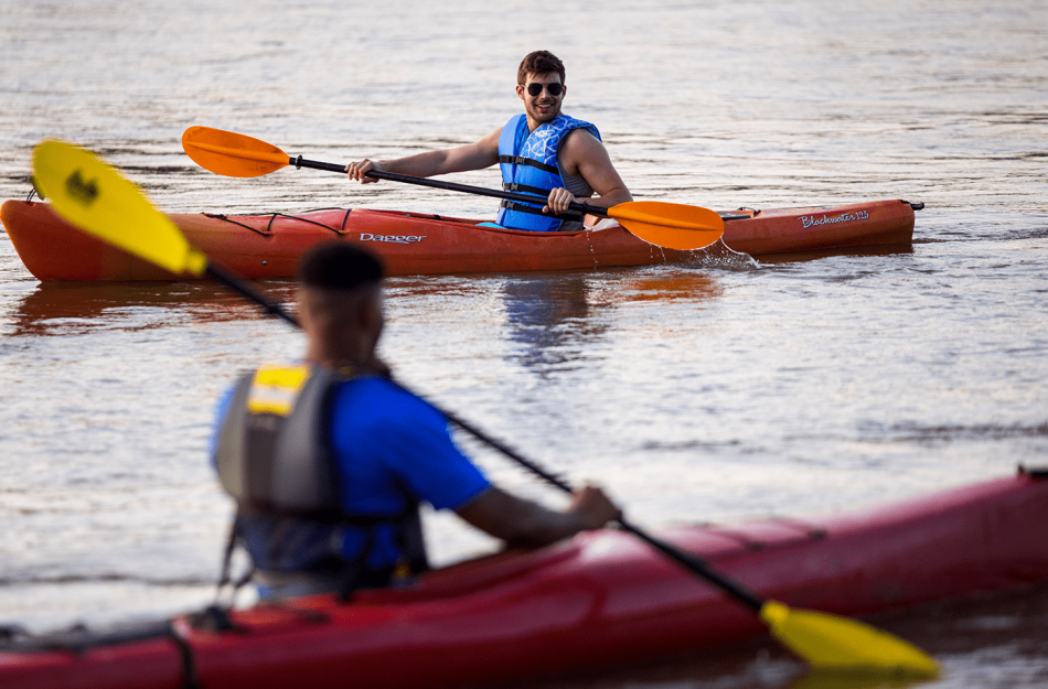 two people canoeing