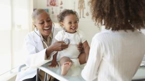 doctor holding a baby