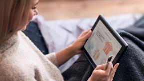 woman looking at her tablet