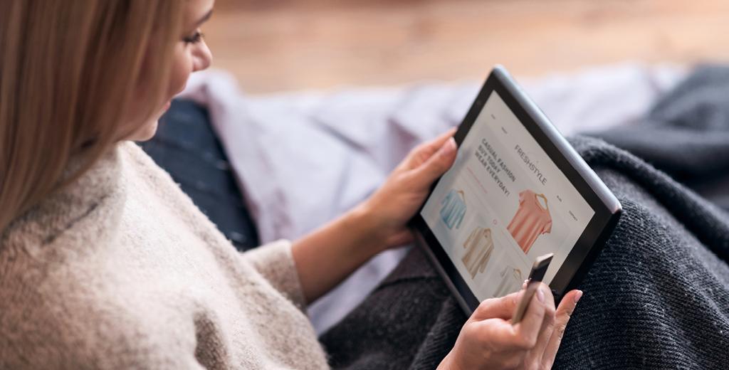 woman looking at her tablet