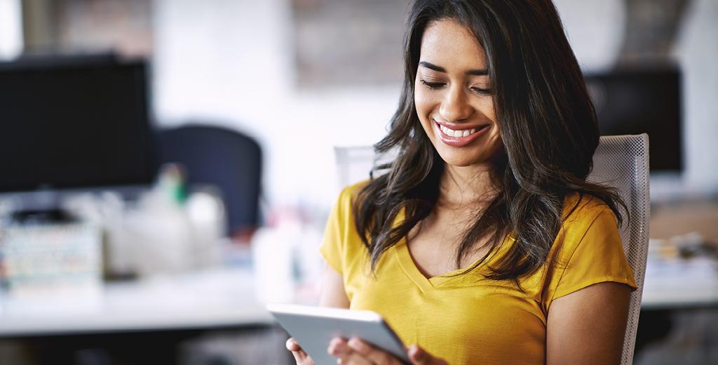 woman looking at her tablet